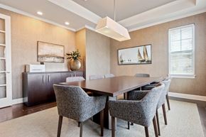 North Chili apartment for rent - a dining room with a wooden table and chairs