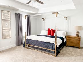 Spartanburg apartment for rent - a bedroom with a bed and a ceiling fan