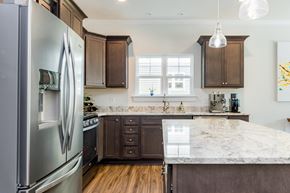 Spartanburg apartment for rent - a kitchen with stainless steel appliances and marble counter tops