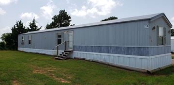 Shawnee house for rent - A blue building with the number 23 on it.