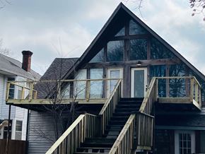 Jonesboro apartment for rent - A house with a staircase leading to a balcony.