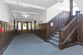 San Francisco apartment for rent - A long hallway with a staircase on the right side.