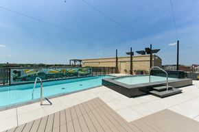 Washington apartment for rent - the pool on the rooftop of a building with a city in the background