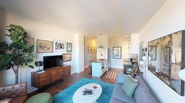 Washington apartment for rent - a living room with a couch and a tv