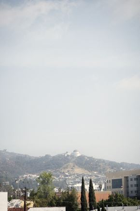 Los Angeles apartment for rent - A cityscape with a mountain in the background.