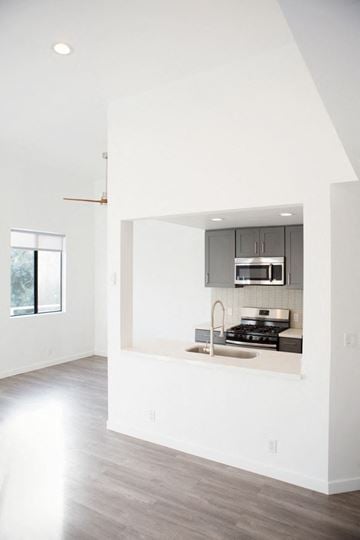Los Angeles apartment for rent - A kitchen with a stove, sink and cabinets.