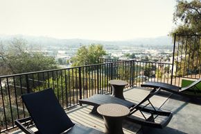 Los Angeles apartment for rent - a deck with chairs and a view of the city