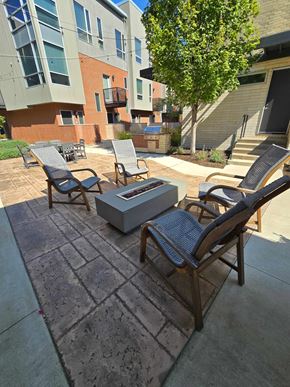 Cleveland apartment for rent - A patio with chairs and a table with a cooler on it.