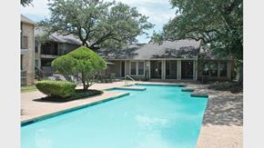 San Antonio apartment for rent - a large swimming pool in front of a house