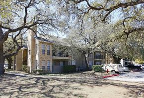 San Antonio apartment for rent - a house with trees and cars parked in front of it