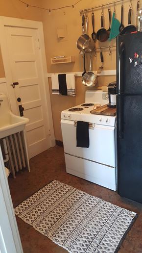 Jonesboro apartment for rent - a small kitchen with a stove and a refrigerator
