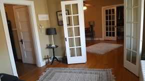 Jonesboro apartment for rent - a room with two open doors and a rug on the floor