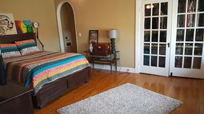 Jonesboro apartment for rent - a bedroom with a bed and a door to a patio