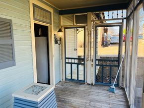 Jonesboro house for rent - the front porch of a home with a porch swing