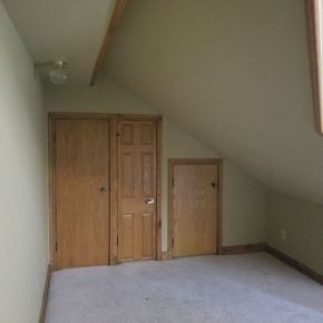 Jonesboro apartment for rent - Two wooden doors in a room with carpeted floor.