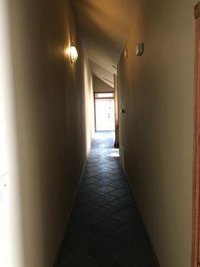 Jonesboro apartment for rent - A long hallway with a light on the wall.