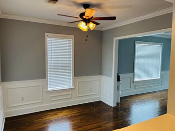 Jonesboro apartment for rent - a living room with white walls and a ceiling fan