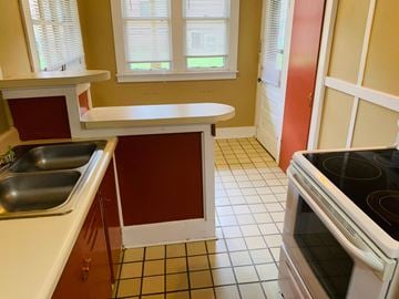 Jonesboro apartment for rent - a kitchen with a stove and a sink and a counter