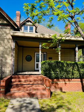 Jonesboro apartment for rent - a front porch of a yellow house with brick steps