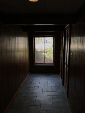 Jonesboro apartment for rent - a dark room with a window and a tile floor