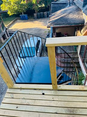 Jonesboro apartment for rent - a view of a pool from the top of a wooden deck