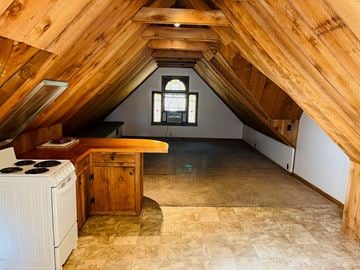 Jonesboro apartment for rent - an attic with a kitchen and a stove and a window