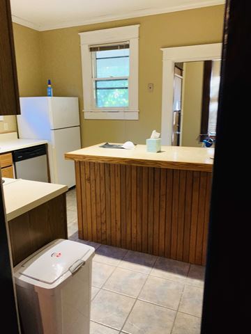 Jonesboro house for rent - a kitchen with a sink and a trash can in it
