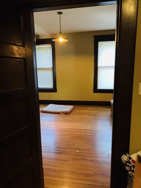 Jonesboro house for rent - a living room with a hard wood floor and two windows