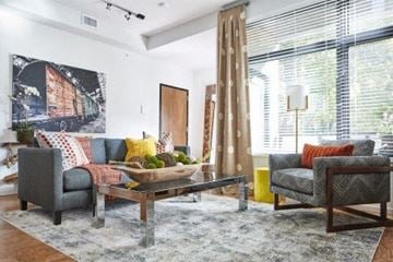 Cleveland apartment for rent - a living room with a couch and chairs and a table