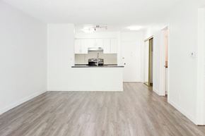 Los Angeles apartment for rent - an empty living room and kitchen with white walls and wood floors