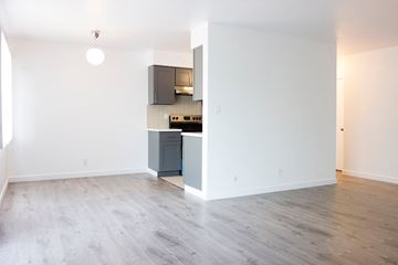 Los Angeles apartment for rent - a living room and kitchen with wood floors and white walls