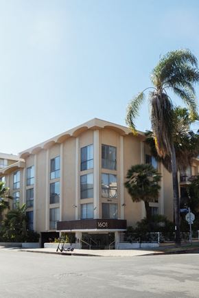 Los Angeles apartment for rent - a building with a palm tree in front of it