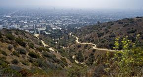 Los Angeles apartment for rent - a winding road on a hill with a city in the background