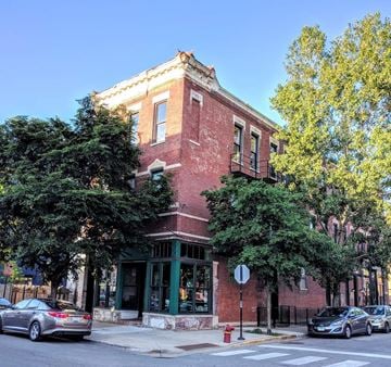 Chicago apartment for rent - a brick building on the corner of a city street