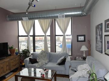 Chicago apartment for rent - a living room with a couch and a table