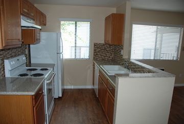 San Diego apartment for rent - a kitchen with a stove refrigerator and a sink