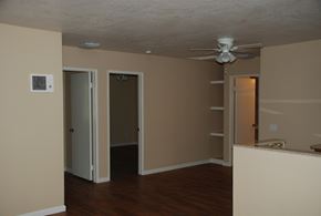 San Diego apartment for rent - an empty living room with a ceiling fan and a closet