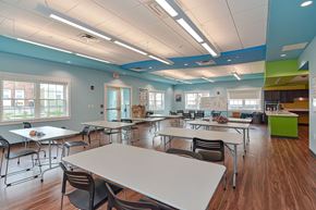 Holyoke apartment for rent - a dining room with tables and chairs in a classroom