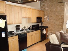 Chicago apartment for rent - a kitchen with a stove sink and refrigerator