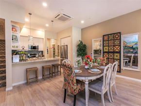 Oxnard townhouse for rent - a dining room and kitchen with a table and chairs