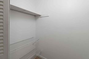 Tampa apartment for rent - A white refrigerator with three shelves.