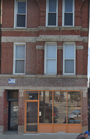 Chicago apartment for rent - the front of a brick building with glass windows