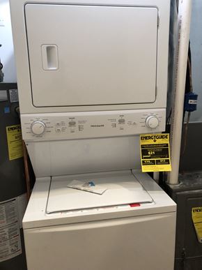 Chicago apartment for rent - a piece of paper sitting on top of a washing machine