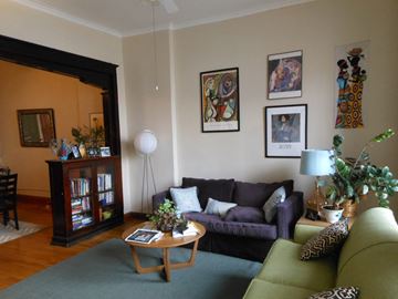 Chicago apartment for rent - A living room with a green couch and a wooden coffee table.