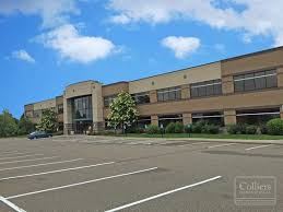 Woodbury apartment for rent - an empty parking lot in front of a large building