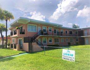 North Miami Beach apartment for rent - A house with a sign in front that says Lisamar.