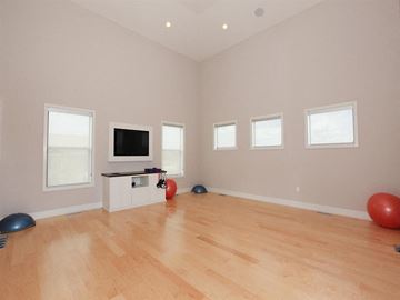 Lenexa apartment for rent - a living room with a tv and a hard wood floor