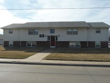 Kearney apartment for rent - the front of a white house with a red door
