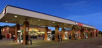Cottage Grove apartment for rent - a gas station with people standing outside of it