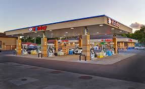Hastings apartment for rent - a gas station with cars parked in front of it